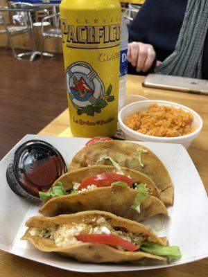 Our dinner.  Crispy beef tacos, Spanish rice and of course a beer.