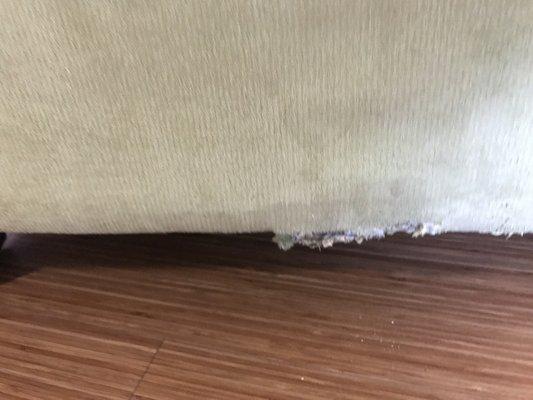 Tore fabric on chair down to wood frame