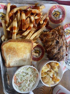 Lunch ribs with fries and coleslaw and additional side of peach cobbler.