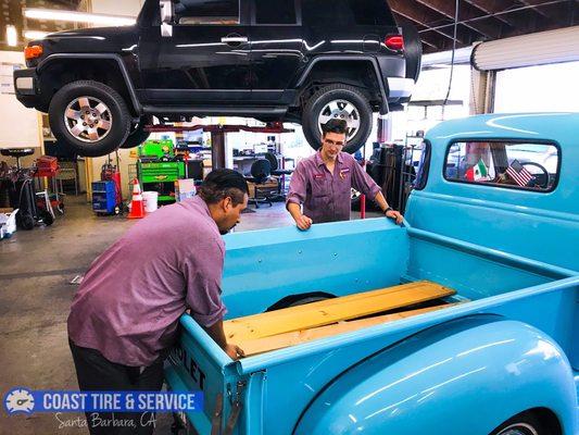 Bryan and José getting the Chevy pickup ready for delivery