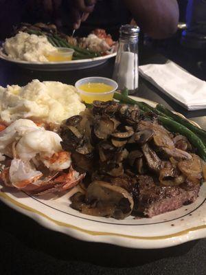 10oz Ribeye and 4oz lobster tail with mashed potatoes and green beans. Yum!