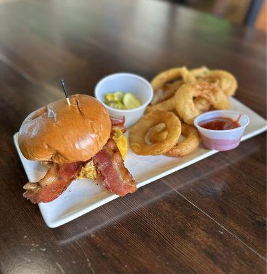 Pulled chicken sandwich with up charge onion rings