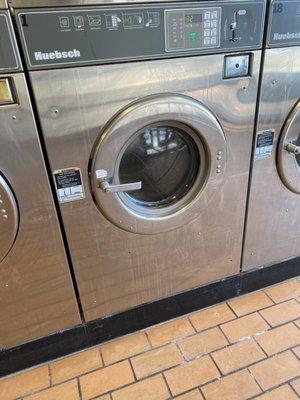 Spilt laundry soap all over the front of the machines.