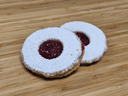 Linzer Cookie! Delicious short bread cookie with raspberry jam and sugar!