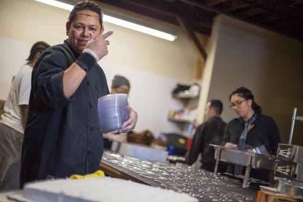 Chef Felix Vargas ready to plate the wedding cake.  Felix has been with Catering Made Simple since it opened in 2013...