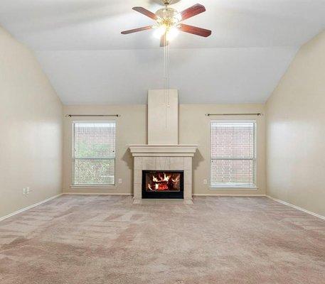 "Before' photo.  Old living room floor and fireplace tile. 'Builder special' materials installed back in 2002.  (Boring.)