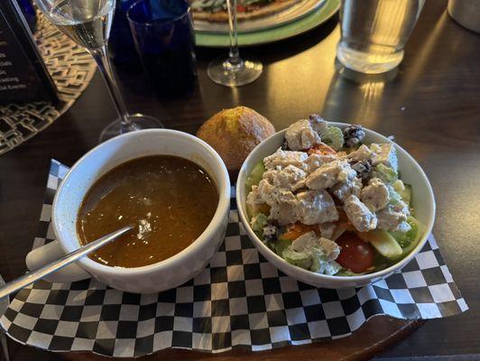 Chili, corn muffin and small chicken salad on salad