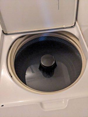 Washing machine full of smelly water. I reported this 6 days ago and sent this picture 2 days ago. It's still unaddressed.