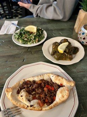 Pepper and lam fatayer, stuffed grape leaves and tabouleh salad