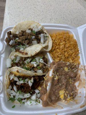 Carne asada, carnitas, pastor taco plate