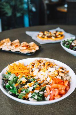 Buffalo Blue Bowl -Chicken breast, brown rice, mixed greens, tomatoes, carrots, blue cheese, creamy feta, zip sauce. (gluten-free, halal)