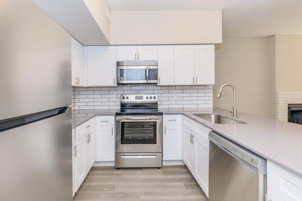 Upgraded apartment homes with stainless steel appliances and quartz countertops available.