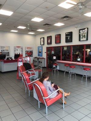 Comfortable waiting area with a tv.