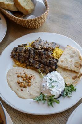 Beef angus kabob Plate served with our hummus cucumber yogurt rice pilaf and pita bread.