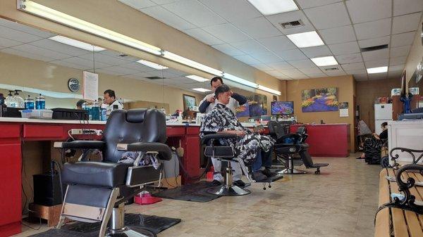 Peter (middle chair) runs the shop but everyone can cut hair really well.