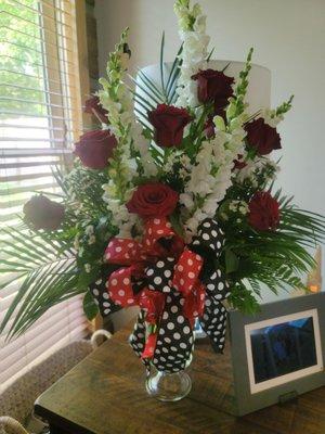 This is the arrangement for my mom's memorial with a hint of Disney. There is a hidden Mickey tucked away.