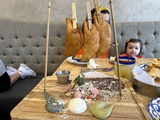 Empanadas, yummy and beautiful presentation, our daughter couldn't stop staring. Also pictured; the very refreshing house Margarita.