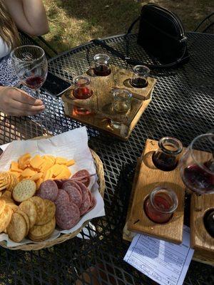 Wine flights paired with meat, cheese, & crackers