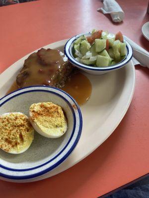 Deviled eggs, meatloaf, cucumber salad.