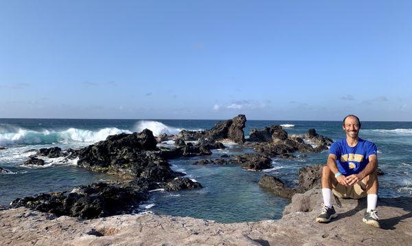 Enjoying the setting beside the rocks and crashing waves.