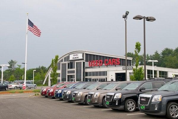 The Quirk Buick GMC building is a modern-looking building between Quirk Chevrolet and Quirk Volkswagen.