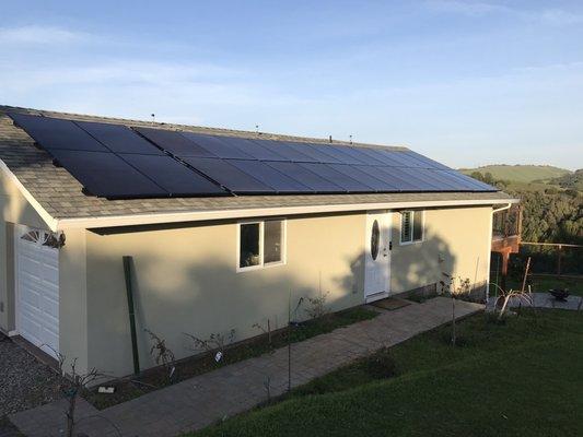 Our garage/barn after the addition of eight more solar panels by AHS.