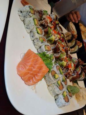 Salmon sashimi, salmon avo rolls, dancing eel roll, showering roll, shrimp tempura roll, and spider roll