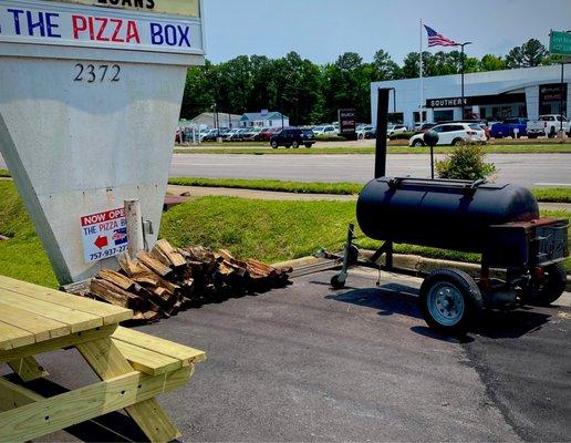 Outdoor signage, picnic area, and smoker set up - upper lot.