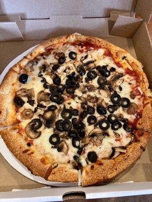 Black olives and mushrooms - Takis Pizza. Our absolute favorite.