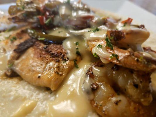 Seafood grits with gouda cheese