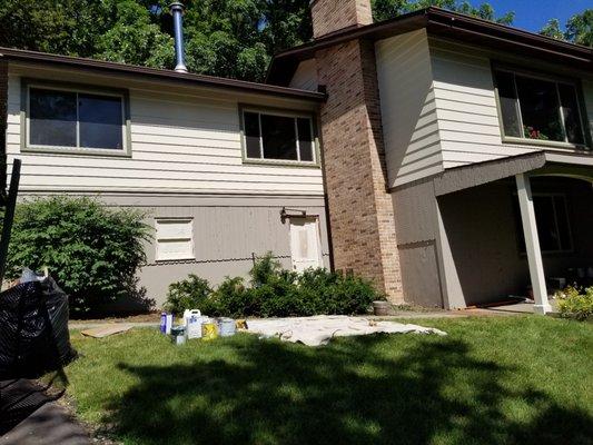 Painting of Aluminum, Wood, and Masonry surfaces to transform the look of this house