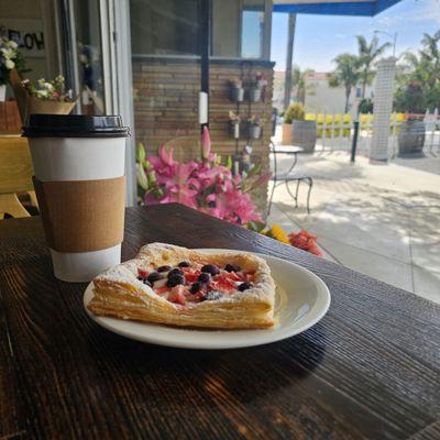 Azteca Picoso Latte and freshly baked berry Danish.