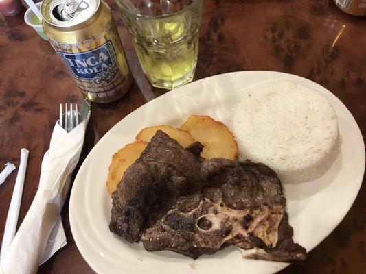 Today's lunch special: chuleta asada, with rice & potatoes.. kinda dry wish it came with a sauce