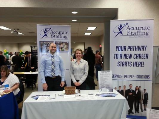 Staff members at Job Fair !  Does anyone see something that isn't right in this photo?