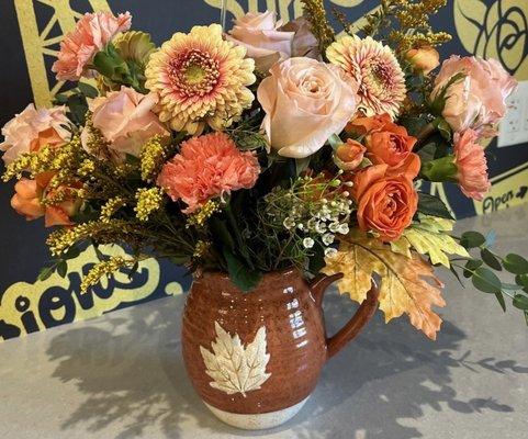 Glorious fall explosion in a beautiful ceramic pitcher.