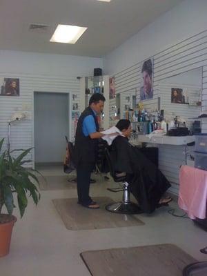 Tommy at work doing s ladies hair