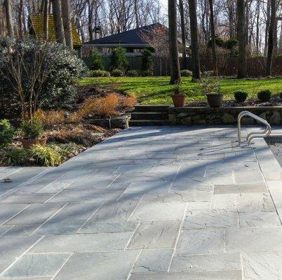 New Premium Bluestone set on a concrete sub-deck during a pool renovation.