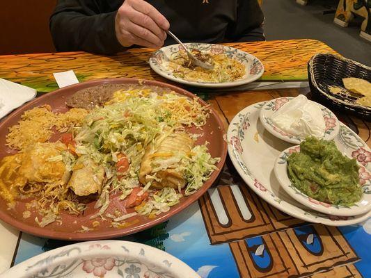 This is a single order combination plate with an ordered side of guacamole and sour cream. Food pretty good grouchy lady bad!