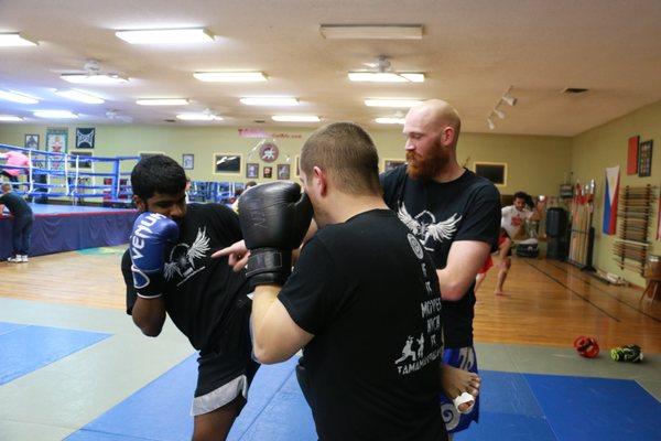 Seth teaching the finer points in Muay Thai training