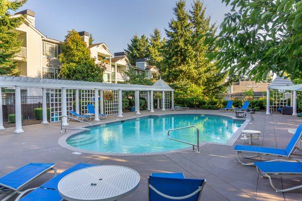 Community swimming pool and seating areas.