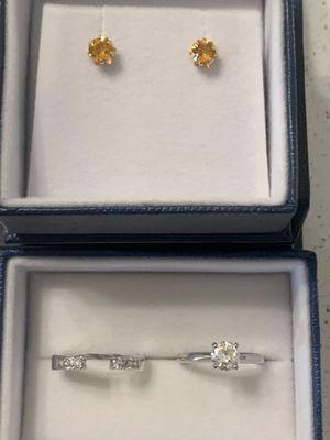 Citrine earrings as well as a re-mounted engagement ring and wedding band.