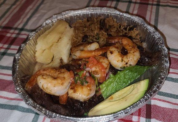 Surf and Turf  (flavorful combination of grilled skirt steak and shrimp, fried yuca, and a mix of rice and beans)