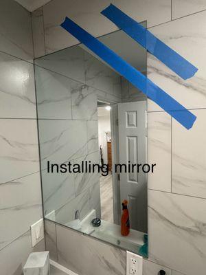 Handyman, installing mirror