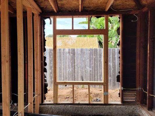 Rough framing for windows and new electrical wiring for a garage conversion Accessory Dwelling Unit (ADU).