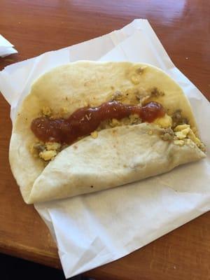 Breakfast taco. Egg and sausage with hot sauce