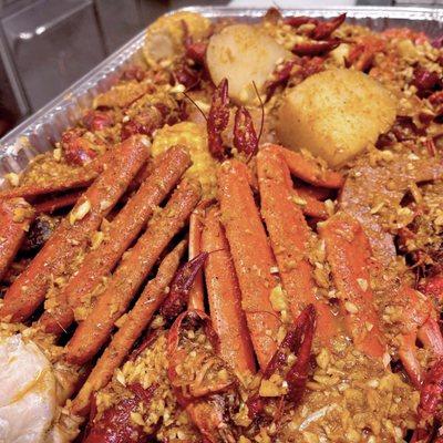 Snow crab, crawfish, corn, potatoes, baby clams, and sausage