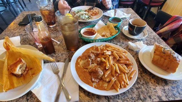 Tamale, pasta vodka with meatballs, salsa and chips, chicken tacos