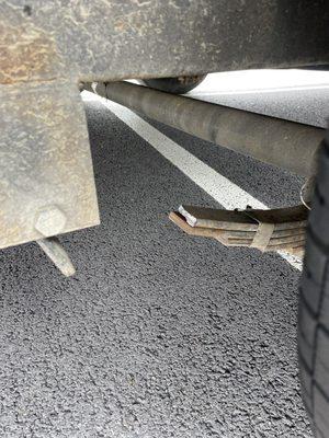 Snapped leaf spring on passenger side rear tire.