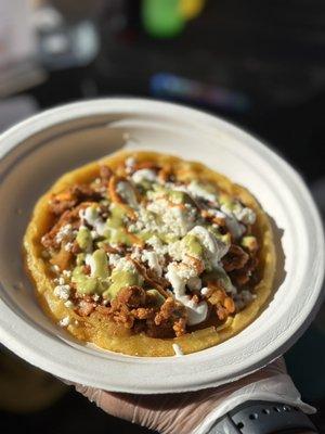 Sopes: corn dough layered with beans, lettuce, protein of choice, sour cream and queso fresco.