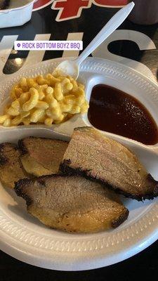 Beef brisket sliced, bbq sauce and Mac and cheese.